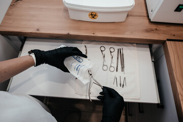 sterilization of manicure tools, Hands are taking manicure tools from craft envelope before...