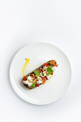 delicious bruschetta with cheese, meat, vegetables in a restaurant
