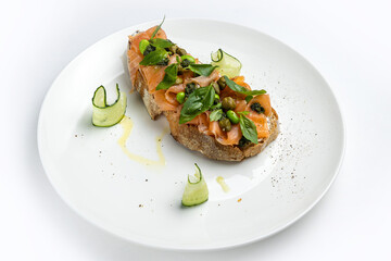 delicious bruschetta with cheese, meat, vegetables in a restaurant
