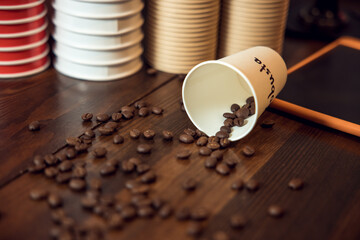 Cafe interior with roasted coffee beans on a wooden table