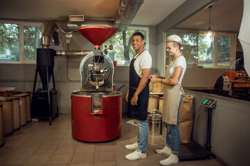 Two cheerful roast masters preparing for work