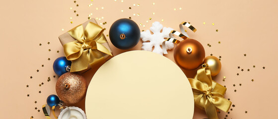 Composition with blank card, Christmas decorations and gifts on beige background