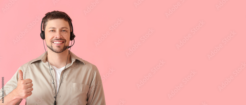Poster male technical support agent showing thumb-up on pink background with space for text
