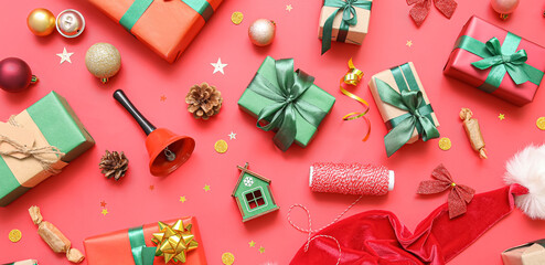 Many Christmas gifts and decor on red background, flat lay