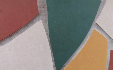 Fondo con detalle y textura de piezas ceramicas de diferentes colores, creando un mosaico