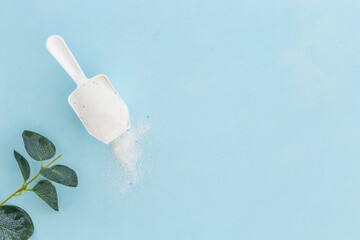 White washing powder with measuring cup. Laundry day concept