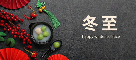Greeting card for Chinese Dongzhi festival (Winetr Solstice) with tasty tangyuan on dark background