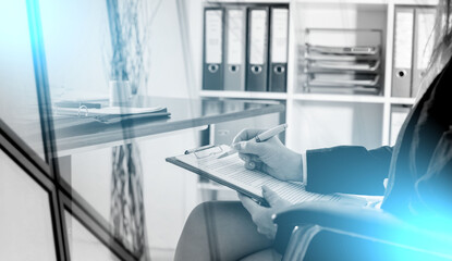 Business woman taking notes; light effect