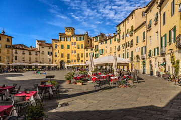 Fototapeta na wymiar Lucca, Italy. Piazza dell'Anfiteatro was built in the Middle Ages on the basis of an ancient Roman amphitheater