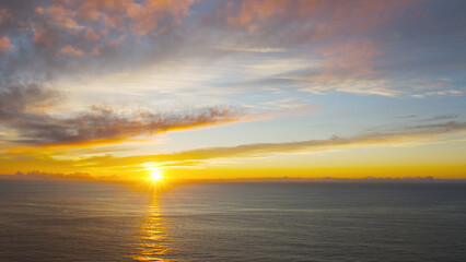 Breathtaking sunset in the calm ocean at the Cabo da Roca, Portugal.