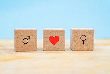 symbols of masculine and feminine with concept of love or infatuation represented in three wooden...
