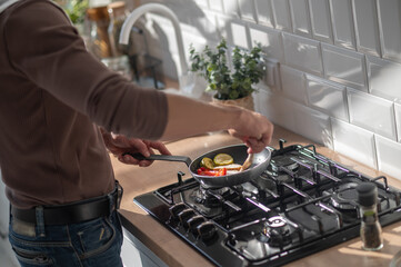 Man cooking something in the kitchen