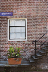 porch and brick wall with a window in Amsterdam 