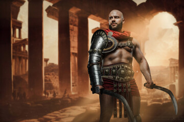 Obraz premium Shot of gladiator dressed in armor holding dual swords on abandoned ruins.