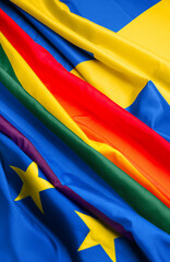 Flags of LGBT, European Union and Sweden as background, closeup