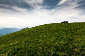 Green hills and valleys in the Alps mountains in Italy