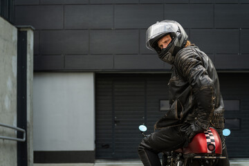 Biker sitting on a motorcycle and looking back