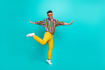 Fototapeta na wymiar Full body length size of young hipster guy student popular celebrity wear sunglass enjoy dancing tiptoe overjoyed isolated on cyan color background