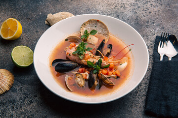 Soup with seafood and herbs