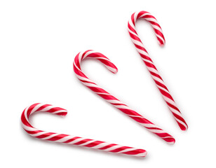Delicious candy canes isolated on white background