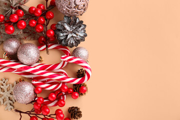 Composition with sweet candy canes and Christmas decorations on color background