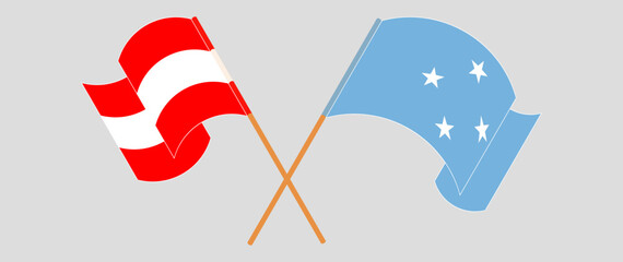 Crossed and waving flags of Austria and Micronesia