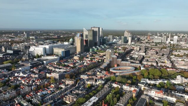 Den Haag Holland Spoort train station, Rode Dorp, China town, Stationsbuurt, Rivierenbuurt and skyline of the Hague in The Netherlands, south Holland. Aerial drone view.