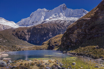 Secluded lake in Cordillera Blanca, snowcapped Andes, Ancash, Peru