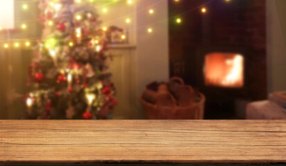 christmas tree and fireplace, wood table background, blur bokeh texture wallpaper