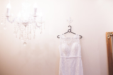 wedding dress hanging on a hanger