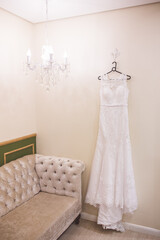 wedding dress hanging on a hanger