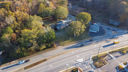 Gas station, business buildings, residential houses near busy intersection of Hamilton Mill Road, Bogan Road in Buford, Georgia
