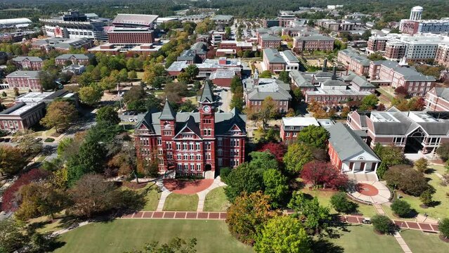 Beautiful college campus in America. Aerial view of Auburn University's Samford Hall. Many brick buildings and open green space.