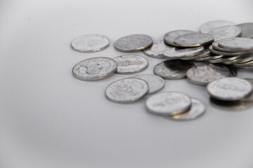 Coins used for payment in Thailand brought together and selective focus