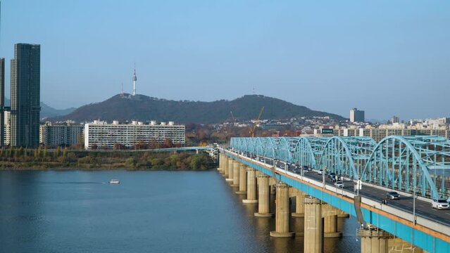 Dongjak Bridge Over Han River In Seoul, South Korea With N Seoul Tower In Background During Autumn. pullback