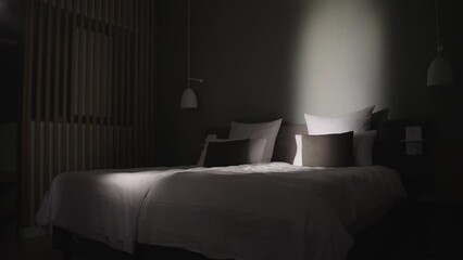 Moving police searchlights through a window showing bedroom by night creating a dramatic and thrilling atmosphere