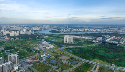 Top view aerial photo from flying drone of a Ho Chi Minh City with development buildings, transportation, energy power infrastructure. Financial and business centers in developed Vietnam.