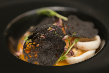 Close up on a seafood soup served for dinner in a gourmet restaurant.