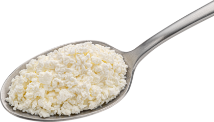 Cottage cheese in spoon isolated, top view
