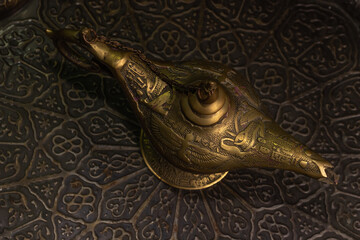 Aladdin's magic lamp isolated on black background