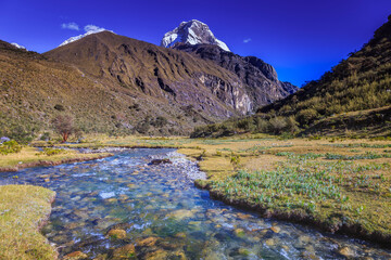 River and Huascaran massif in Cordillera Blanca, snowcapped Andes, Ancash, Peru