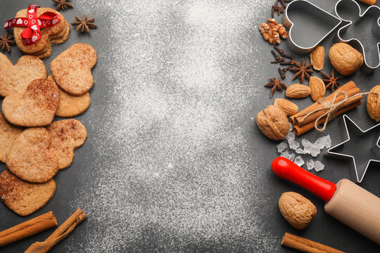Top view of cinnamon cookies, spices, rolling pin, cooking molds. Place for text