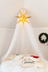 Cozy bedroom decorated for Christmas © Olga Gorchichko