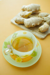 Ginger tea on wooden background.