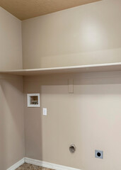 Fototapeta na wymiar Vertical Empty laundry room interior with wall mounted shelf