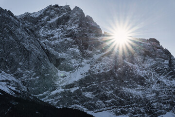 snow covered mountain and sun star - Zugspitze Alps