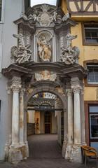 Fototapeta na wymiar Nice close-up view of the baroque entrance gate of the St. Gangolf's Church in Trier, Germany. The gate of the Roman Catholic church was created by the Augustinian Josef Walter in 1731-32.