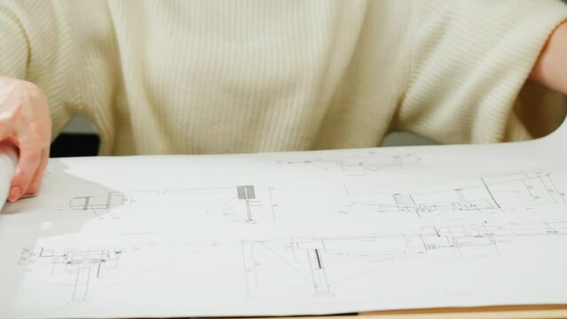 Architect designer drawing plan blueprint close-up. Professional engineer working, interior creator making architectural house project, drafting building.