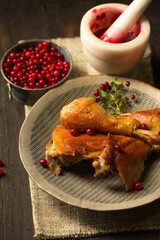 Fried chicken with delicious juicy lingonberry sauce on a plate