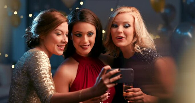 Friends, party and smile for selfie at event, concert or gathering together for birthday celebration. Happy women smiling for photo moments, social media or celebrating friendship with smartphone